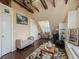 Spacious attic features wood beams, seating, and a window bench at 2504 W North A St # A, Tampa, FL 33609
