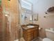 Bathroom with tiled shower, granite vanity, and great lighting at 2504 W North A St # A, Tampa, FL 33609