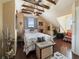 Charming bedroom with exposed beams, ceiling fan, and comfortable furnishings at 2504 W North A St # A, Tampa, FL 33609