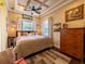 Comfortable bedroom with a coffered ceiling, natural light, and stylish decor at 2504 W North A St # A, Tampa, FL 33609