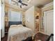 Cozy bedroom features a bed, decor and and en-suite bathroom at 2504 W North A St # A, Tampa, FL 33609