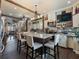 An open-concept kitchen with an island, bar stools, and adjacent to a living space at 2504 W North A St # A, Tampa, FL 33609