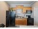 Compact kitchenette includes wood cabinets, essential appliances, and ample counter space at 2504 W North A St # A, Tampa, FL 33609