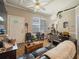 Cozy living room with elegant ceiling fan and natural light filtering through the large windows at 2504 W North A St # A, Tampa, FL 33609