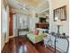 Cozy living room with hardwood floors, accent brick wall, large windows, and comfortable seating at 2504 W North A St # A, Tampa, FL 33609