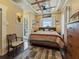 Comfortable bedroom with decorative ceiling, wooden furniture, and plenty of natural light at 2504 W North A St # A, Tampa, FL 33609