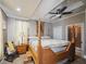 Relaxing main bedroom with tray ceiling, fan, and en suite bathroom at 2504 W North A St # A, Tampa, FL 33609