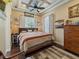 Inviting bedroom featuring a decorative ceiling, wood floors, and ample natural light at 2504 W North A St # A, Tampa, FL 33609