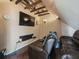 Attic space media room features wood beams, seating, and wall-mounted decor at 2504 W North A St # A, Tampa, FL 33609