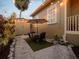 Cozy backyard patio featuring string lights, an outdoor dining set, and lush landscaping at 2504 W North A St # A, Tampa, FL 33609