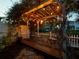 Enchanting outdoor pergola adorned with string lights, creating a cozy and inviting atmosphere at 2504 W North A St # A, Tampa, FL 33609
