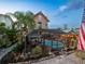 Scenic twilight view of the pool and patio area, fully screened in with tropical landscaping around the perimeter at 2504 W North A St # A, Tampa, FL 33609