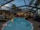 Enclosed pool area aglow, with ambient lighting enhancing the nighttime allure at 2504 W North A St # A, Tampa, FL 33609