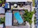 Aerial view of a screened-in pool and backyard oasis featuring comfortable lounge area at 2504 W North A St # A, Tampa, FL 33609