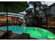 Inviting screened in pool area illuminated for a magical evening ambiance at 2504 W North A St # A, Tampa, FL 33609