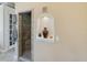 Bathroom view highlighting a tiled shower with pebble flooring and a unique wall niche at 2504 W North A St # A, Tampa, FL 33609
