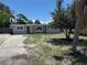 Charming single-story home with a well-maintained yard and mature trees at 2907 W Elrod Ave, Tampa, FL 33611