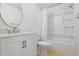 Bright bathroom featuring white vanity, toilet, and shower-tub combo at 302 Lake Parsons Grn # 104, Brandon, FL 33511