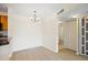 Well-lit dining area with chandelier, bright walls, and neutral flooring at 302 Lake Parsons Grn # 104, Brandon, FL 33511