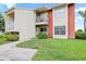 Charming two-story condo featuring a private balcony and well-maintained lawn, perfect for relaxed outdoor living at 302 Lake Parsons Grn # 104, Brandon, FL 33511