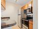 Well-appointed kitchen featuring stainless steel appliances, a tiled floor and plenty of counter space for cooking enjoyment at 302 Lake Parsons Grn # 104, Brandon, FL 33511