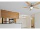 Contemporary kitchen featuring stainless steel appliances, a breakfast bar, and seamless flow into the dining area at 302 Lake Parsons Grn # 104, Brandon, FL 33511