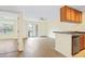 Open-concept living area with sliding glass doors leading to outdoor area at 302 Lake Parsons Grn # 104, Brandon, FL 33511