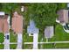 Aerial view of a home with a well-maintained lawn and a long driveway leading up to the house at 309 Congress St, Oldsmar, FL 34677