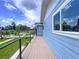Balcony view from a two story building featuring blue siding and cable railings at 309 Congress St, Oldsmar, FL 34677