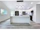 Contemporary kitchen with an expansive center island and an open floor plan concept at 309 Congress St, Oldsmar, FL 34677