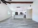 Open concept living area with views of the kitchen and light wood-look floors at 309 Congress St, Oldsmar, FL 34677