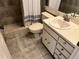 Bathroom with beige tile, standard toilet, shower and white vanity at 3151 Landmark Dr # 115, Clearwater, FL 33761