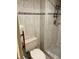Bathroom shower with light colored tile, glass doors and toilet at 3151 Landmark Dr # 115, Clearwater, FL 33761