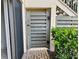 Exterior condo gate leading to a screened in patio area at 3151 Landmark Dr # 115, Clearwater, FL 33761