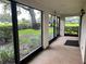 Screened condo patio offering a peaceful outdoor living space with views of the yard at 3151 Landmark Dr # 115, Clearwater, FL 33761