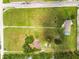 Wide aerial view of property, highlighting generous lot size and surrounding greenery at 34215 Kiefer Rd, Dade City, FL 33525