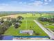 Expansive aerial view of the property showcasing its location surrounded by nature at 34215 Kiefer Rd, Dade City, FL 33525