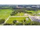 Aerial view showcasing the property's large lot with mature trees and serene surroundings at 34215 Kiefer Rd, Dade City, FL 33525