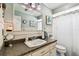 Bathroom featuring vanity with ample counter space and a framed mirror at 34215 Kiefer Rd, Dade City, FL 33525