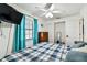 Bedroom with light blue curtains and a ceiling fan at 34215 Kiefer Rd, Dade City, FL 33525