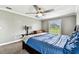 Inviting bedroom featuring neutral paint, carpet, and a large bright window at 34215 Kiefer Rd, Dade City, FL 33525