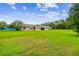Charming single-story home featuring a well-manicured lawn and stone accents at 34215 Kiefer Rd, Dade City, FL 33525
