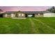Charming home features a long driveway, screened in pool, and spacious green lawn at 34215 Kiefer Rd, Dade City, FL 33525