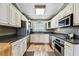 This modern kitchen features stainless steel appliances, granite countertops, and ample storage at 34215 Kiefer Rd, Dade City, FL 33525