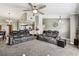 Open-concept living space showcasing seating area and access to the kitchen at 34215 Kiefer Rd, Dade City, FL 33525