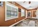 Well-lit sunroom with windows offering scenic views of surrounding area at 34215 Kiefer Rd, Dade City, FL 33525