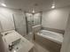 Bright main bathroom features double sinks, a separate shower, and a soaking tub at 36233 Joseph Blake St, Zephyrhills, FL 33541