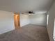 Spacious main bedroom with neutral walls and carpet flooring offers a ceiling fan and walk-in closet access at 36233 Joseph Blake St, Zephyrhills, FL 33541