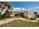 Charming single-story home with a well-kept front yard and tropical landscaping at 4434 Dewey Dr, New Port Richey, FL 34652