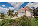 Ranch-style house featuring an American flag and attached garage at 4434 Dewey Dr, New Port Richey, FL 34652